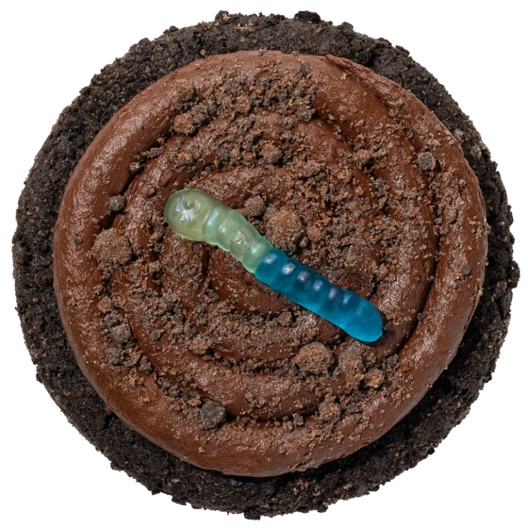 Crumbl Dirt Cake Cookie with fudge frosting, cookie crumbs and a gummy worm